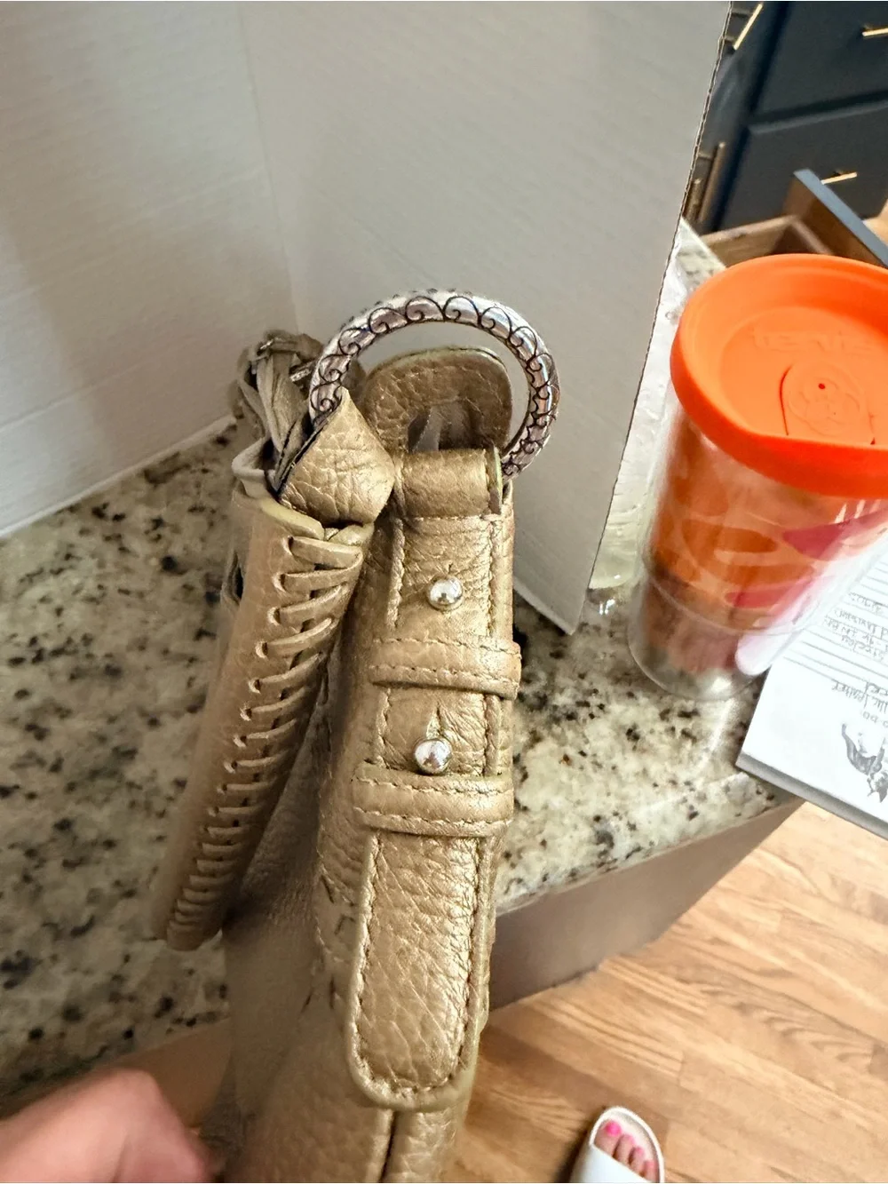 Brighton Gold Pebbled Leather Shoulder Bag with Tassel Accent